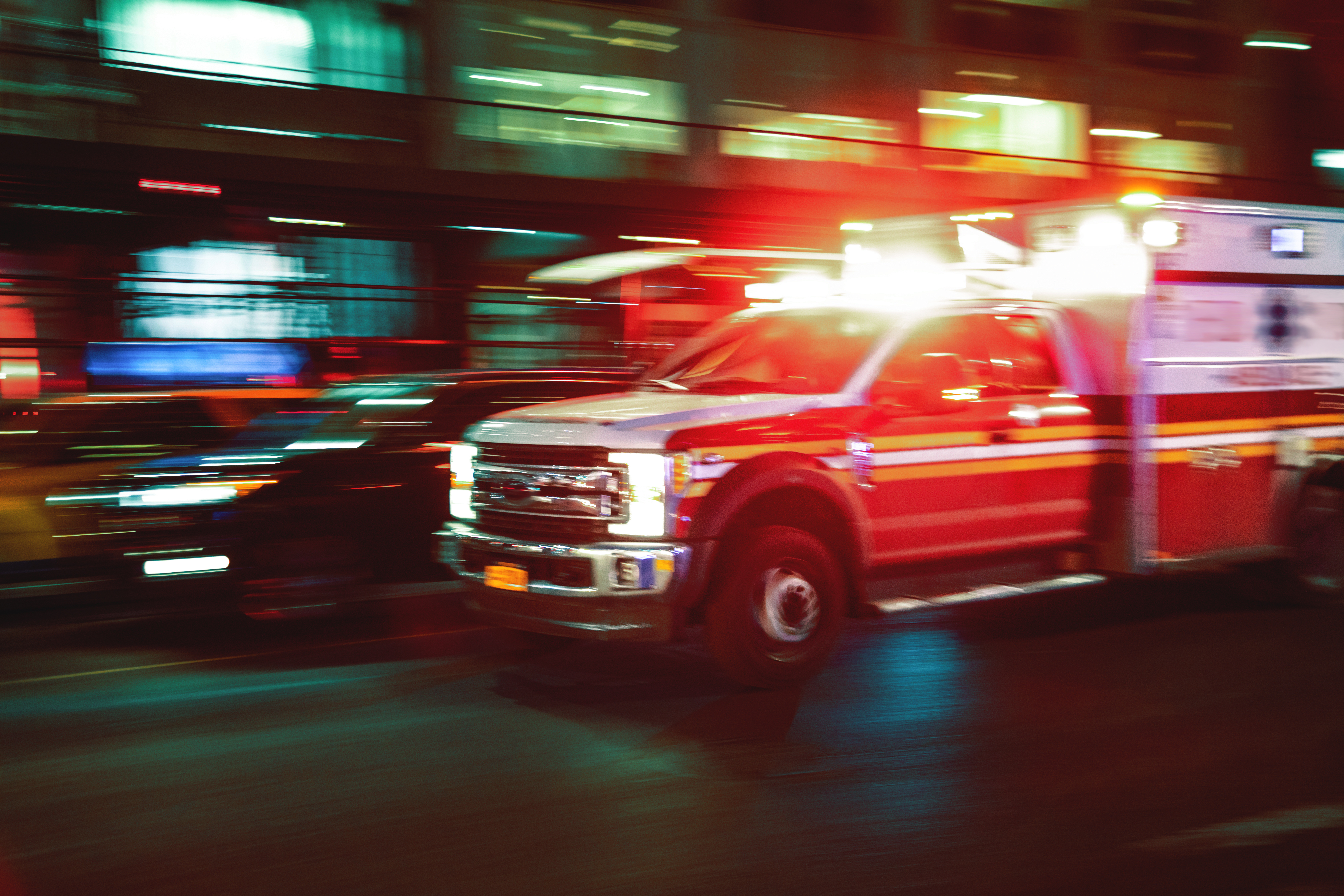 An emergency vehicle driving to the hospital.