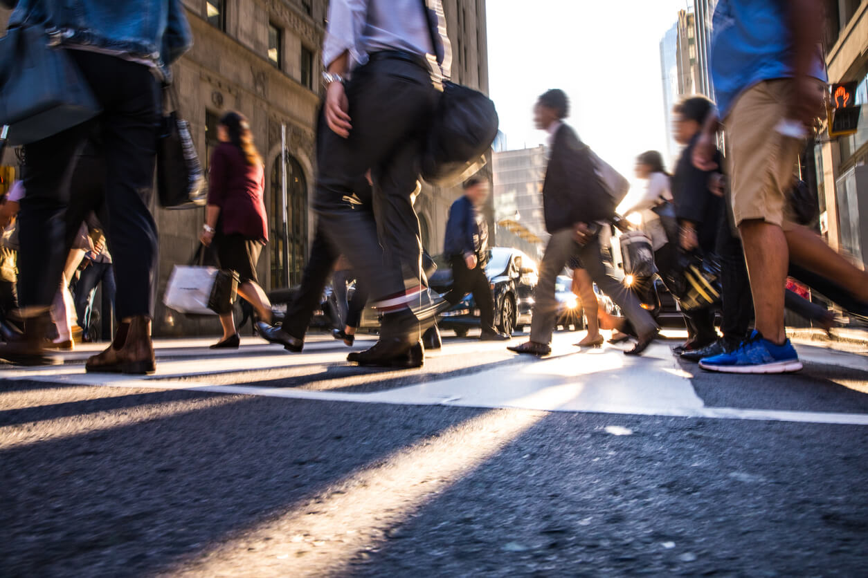 People crossing over an intersection in New York.